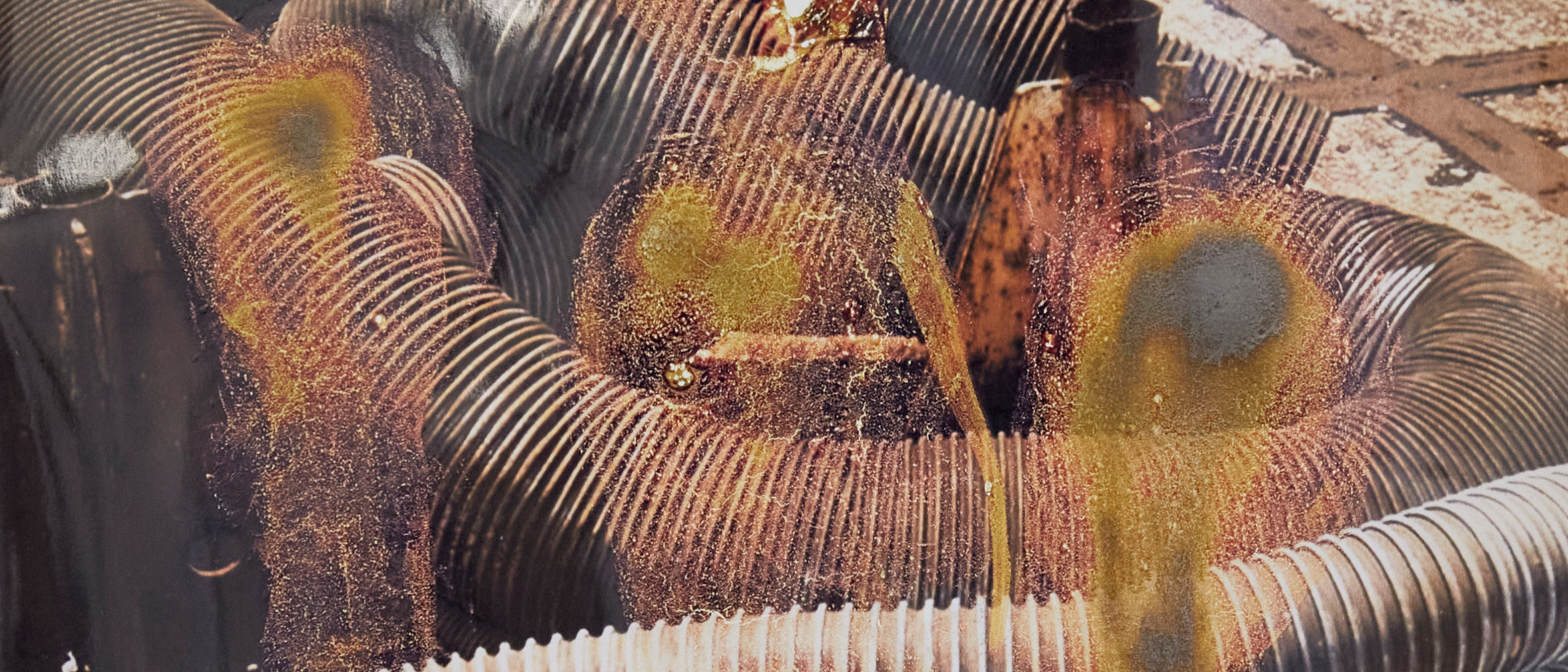 Photo of industrial piping and sprayed on oil. Work by Martin Del Busto - MA Fine Art: Photography, Camberwell College of Arts.