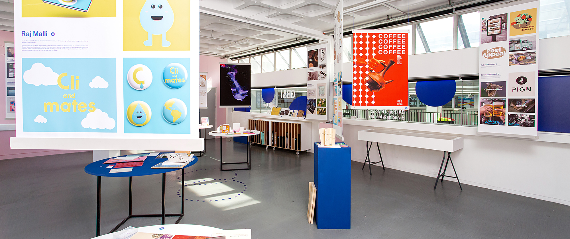 Exhibition shot of graphic branding and identity work inlcuding posters and colourful displays.