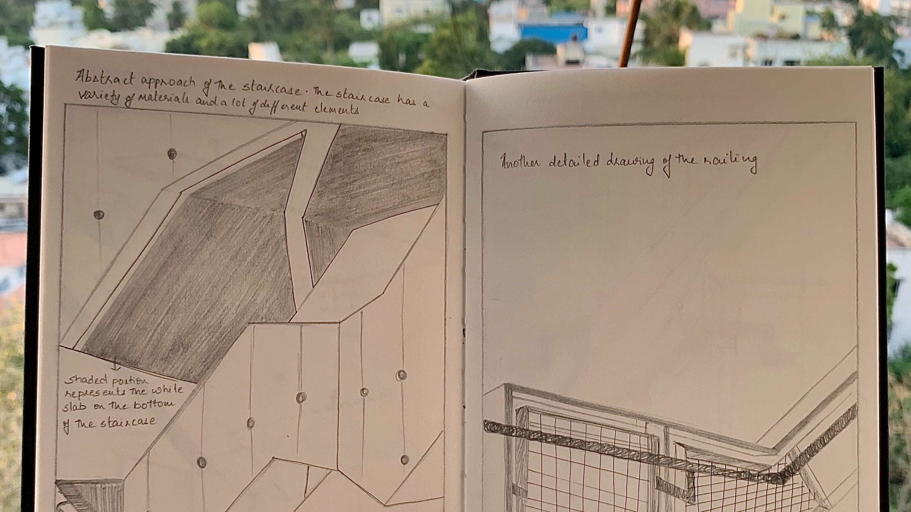 Pencil illustrations in a notebook held over a city skyline
