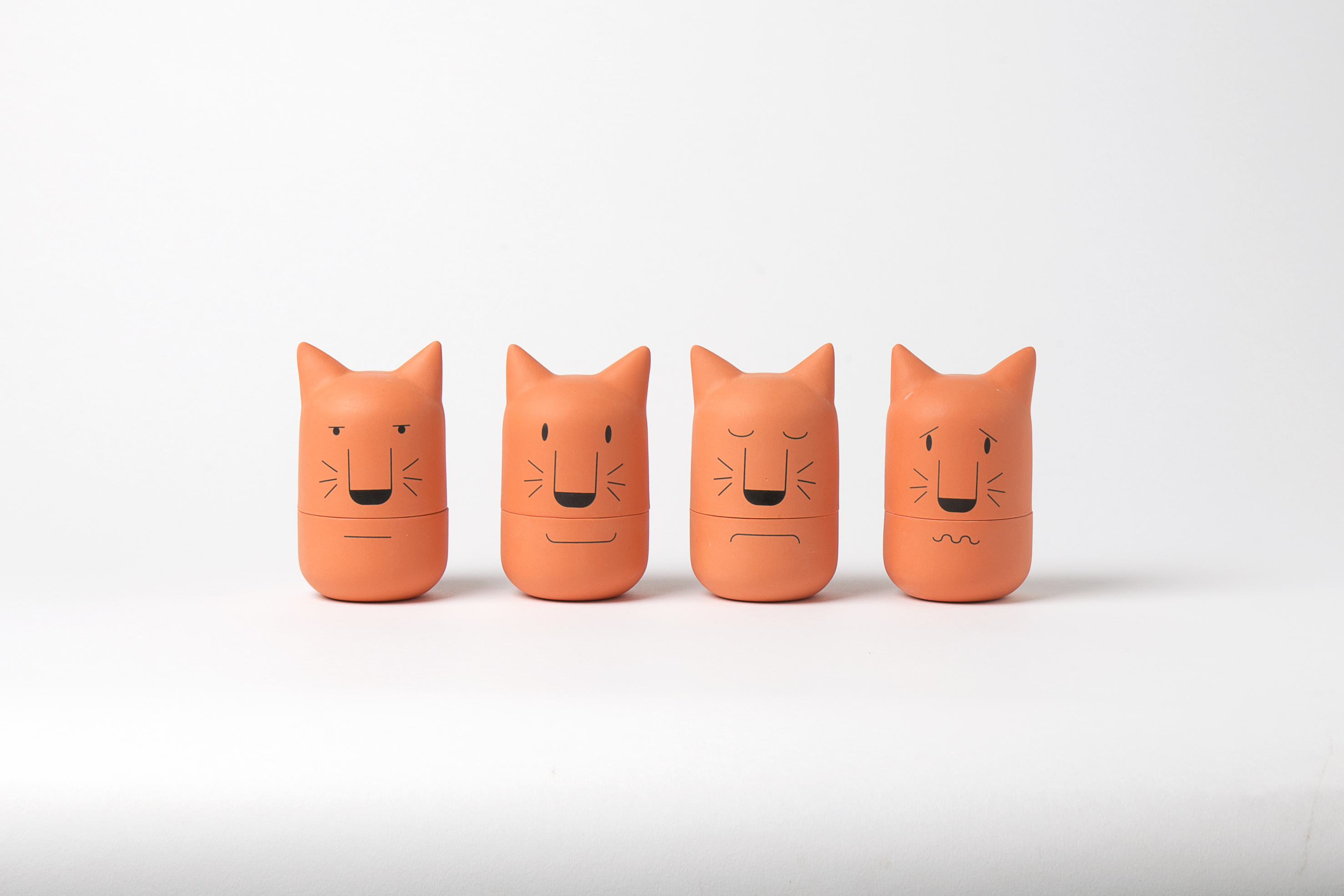 Four terracotta cat heads 