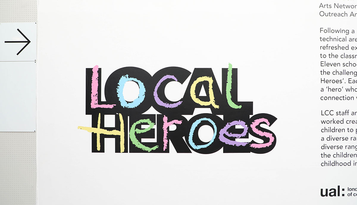 Image depicts a wall exhibit which reads 'Local Heroes' in a large, colourful font.