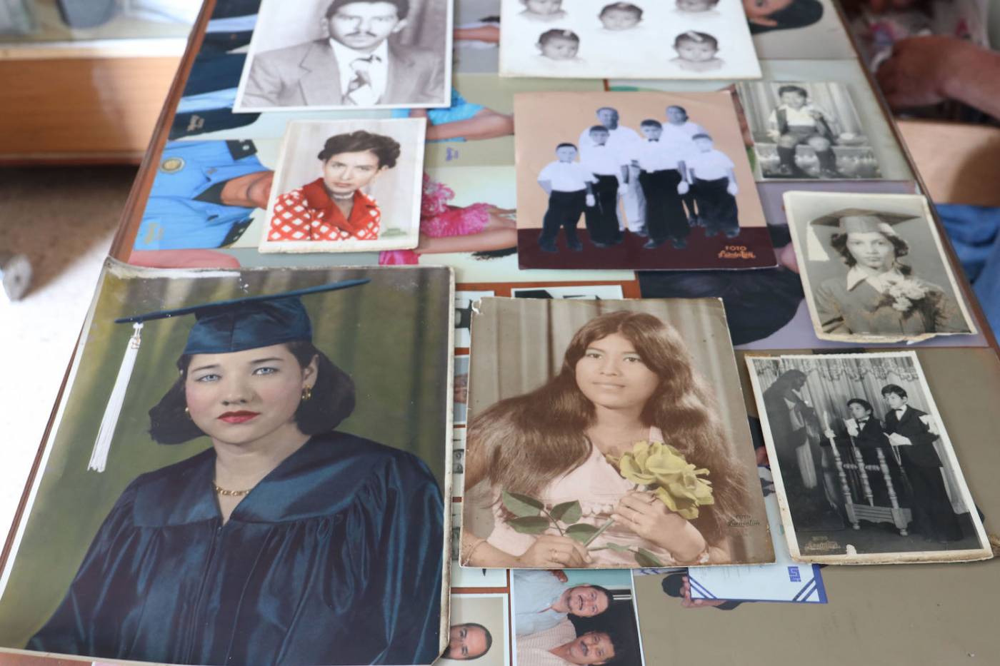 A selection of portrait photos on a table shot from above