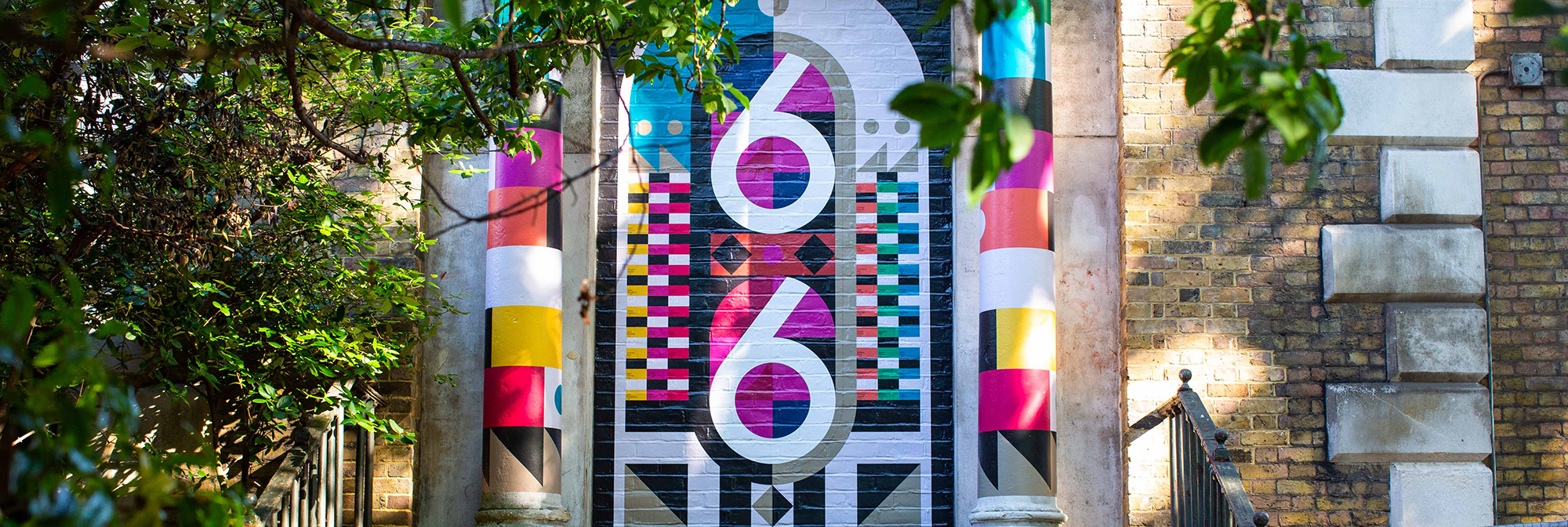 Colourful graphics painted on wall by Chelsea BA Graphic Design Communication student as part of Clerkenwell design week.