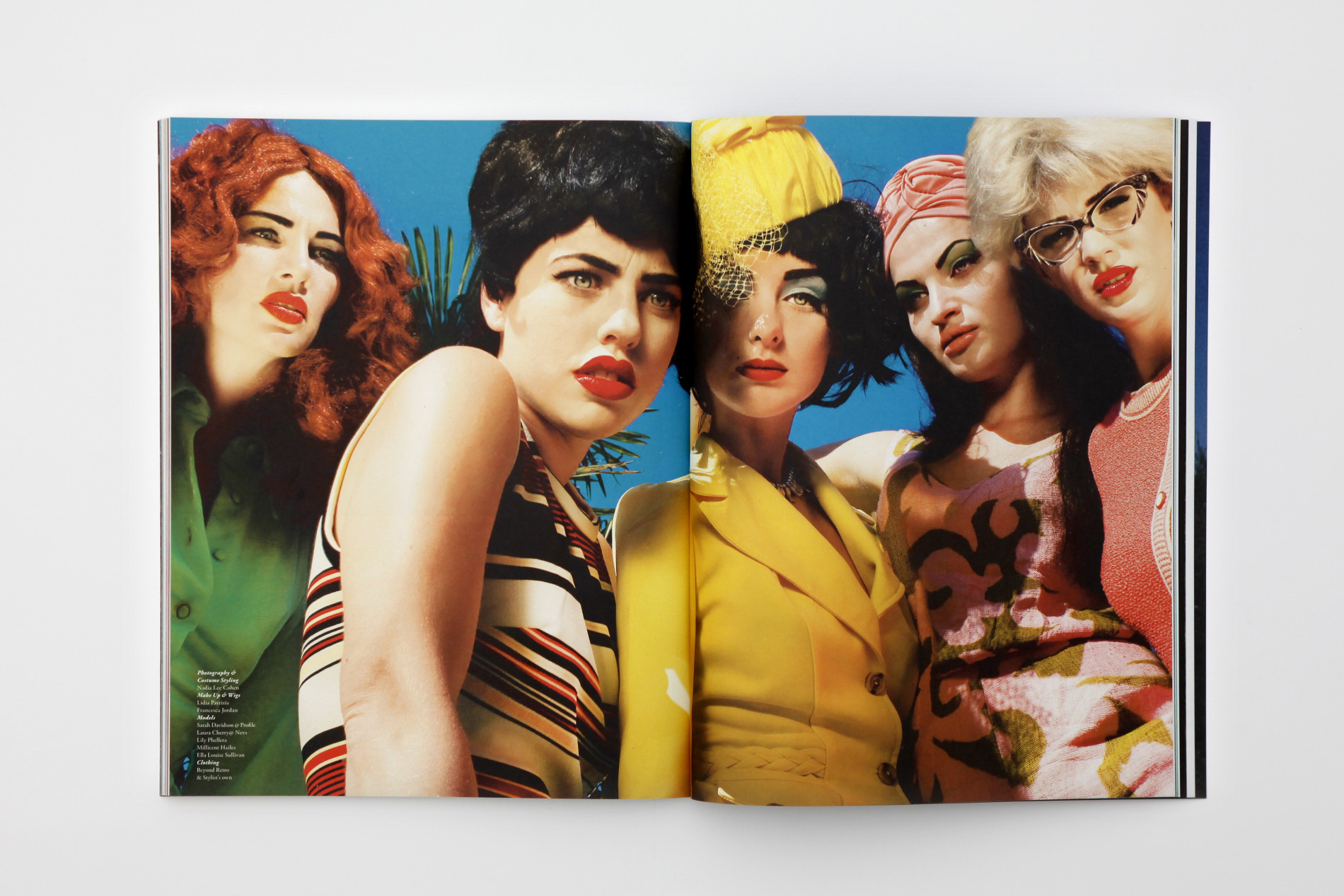 Double spread of Pigeons and Peacocks magazine featuring female models in striking colour outfits.