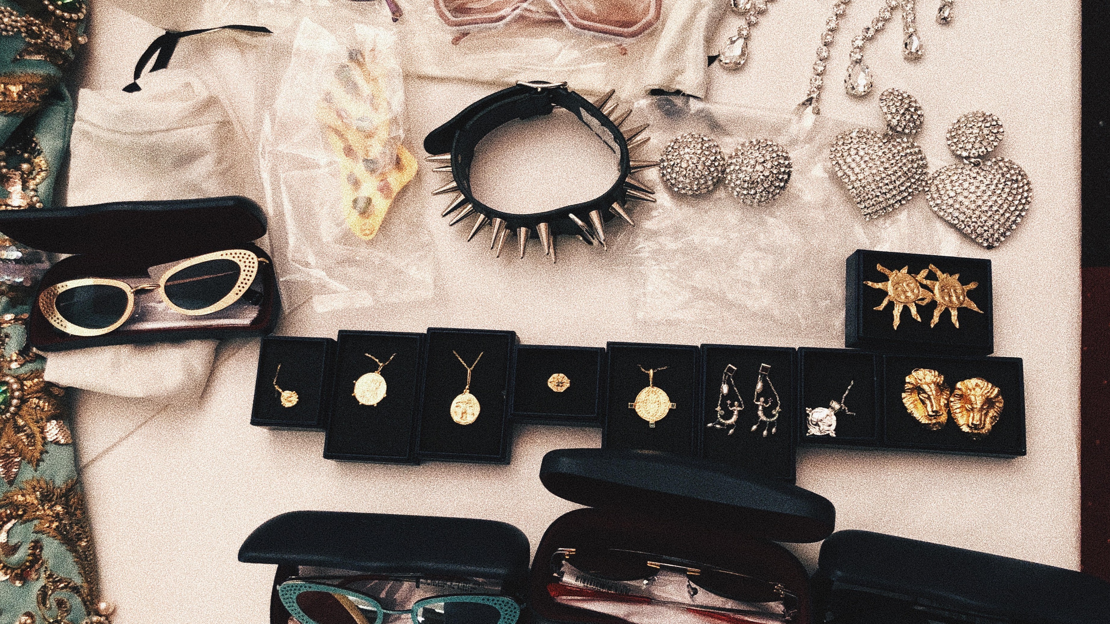 Selection of fashion memorabilia including sunglasses and chokers.