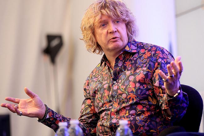 Profile image of Gary Knight mid talk on stage in floral shirt