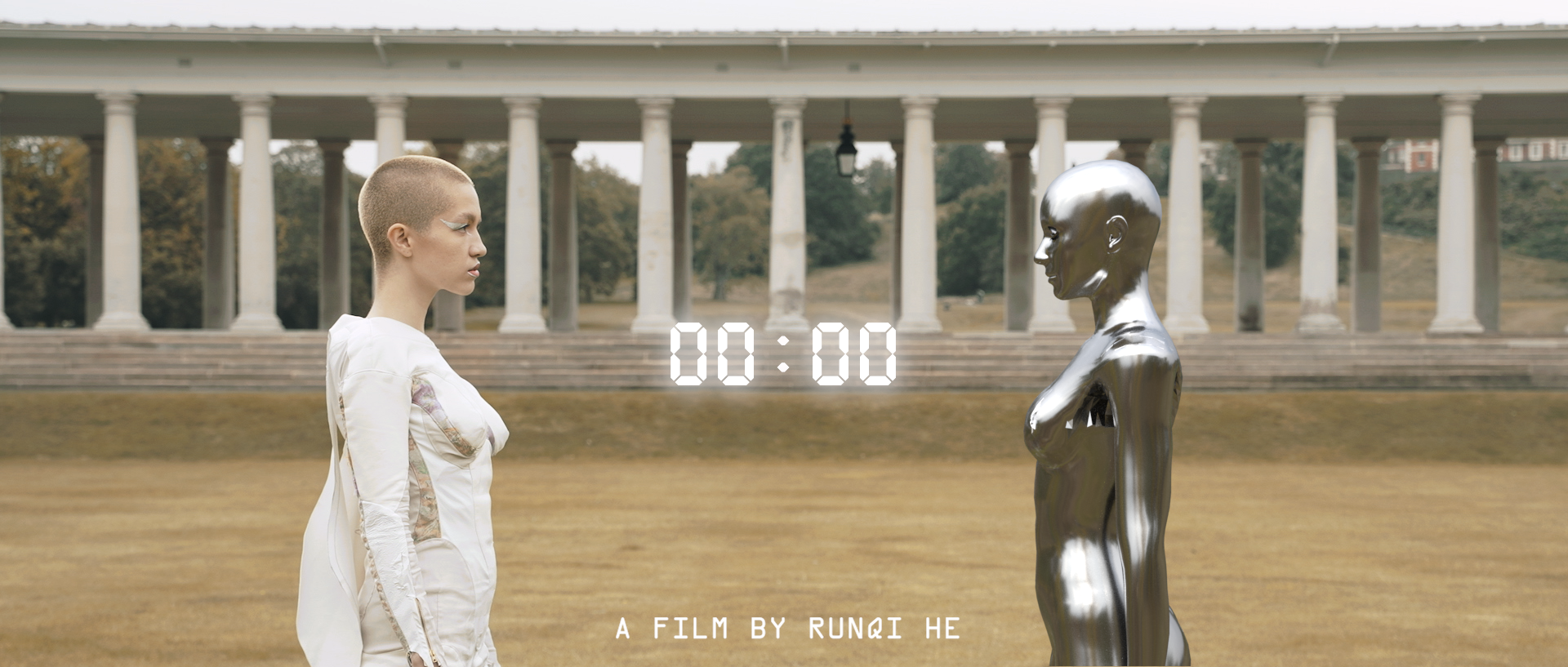 Still from film of two females, one real and one robot, looking at each other.