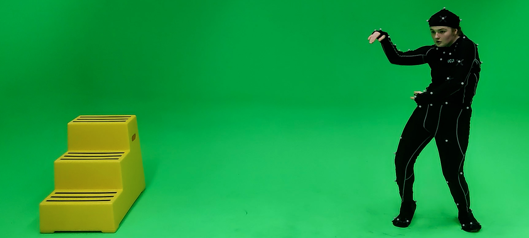 Green screen with figure in VR suit.