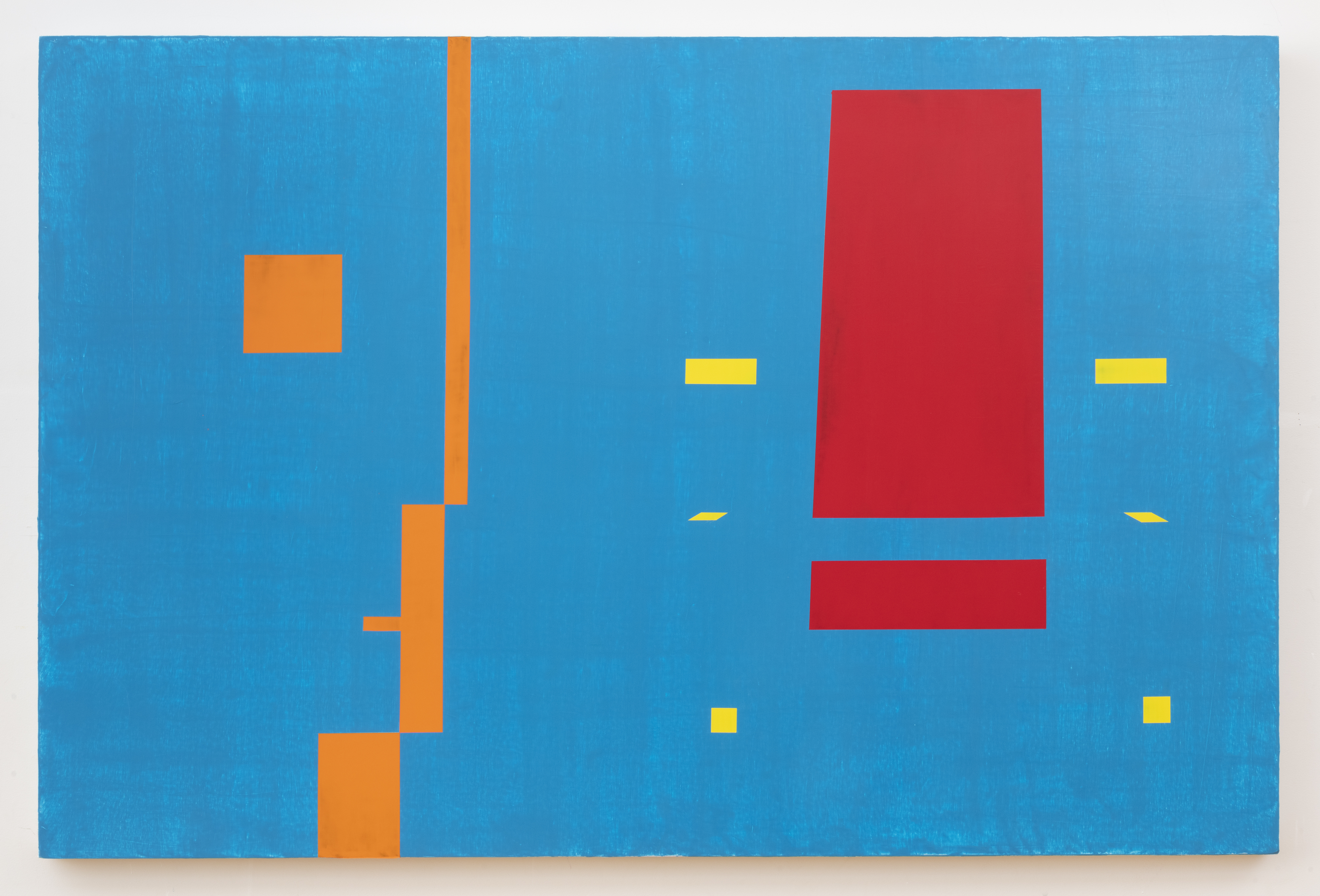 An abstract painting of blocks in red, orange and yellow against a blue background
