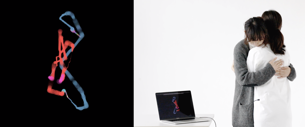 couple embracing in front of digital image