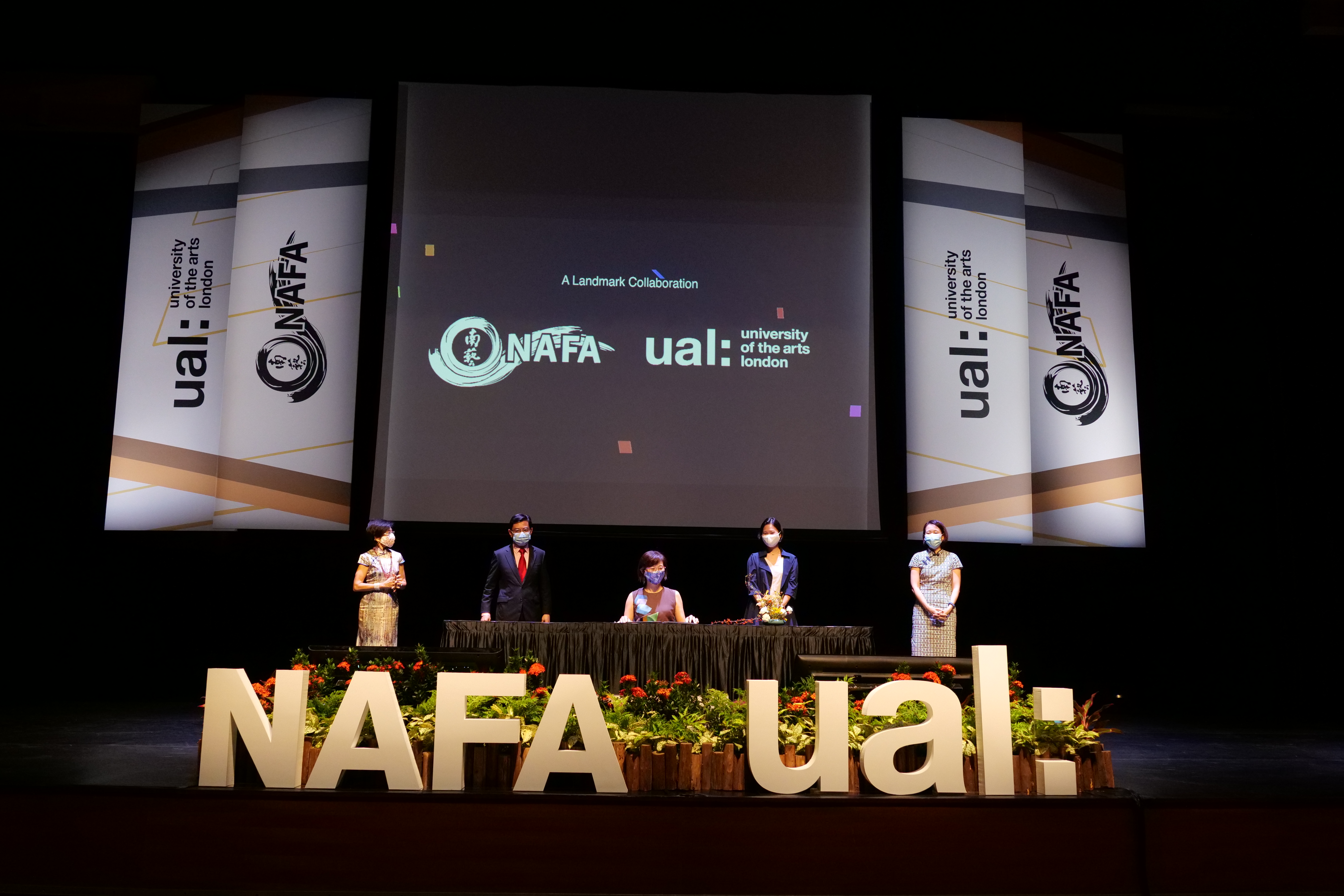 5 people on stage with NAFA and UAL logos in the fore and background