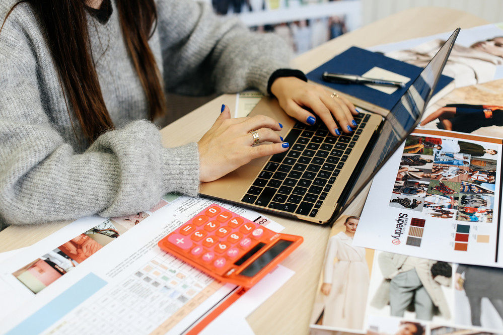 laptop with workbook and calculator 