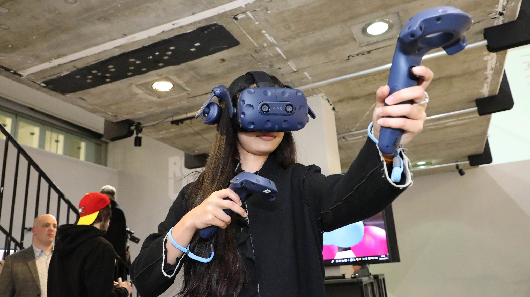 Woman wearing VR headset pointing