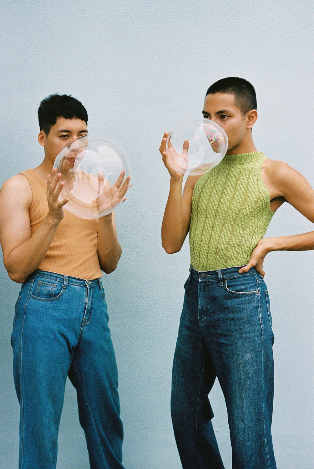 Two male models, blowing bubbles, photographed by student