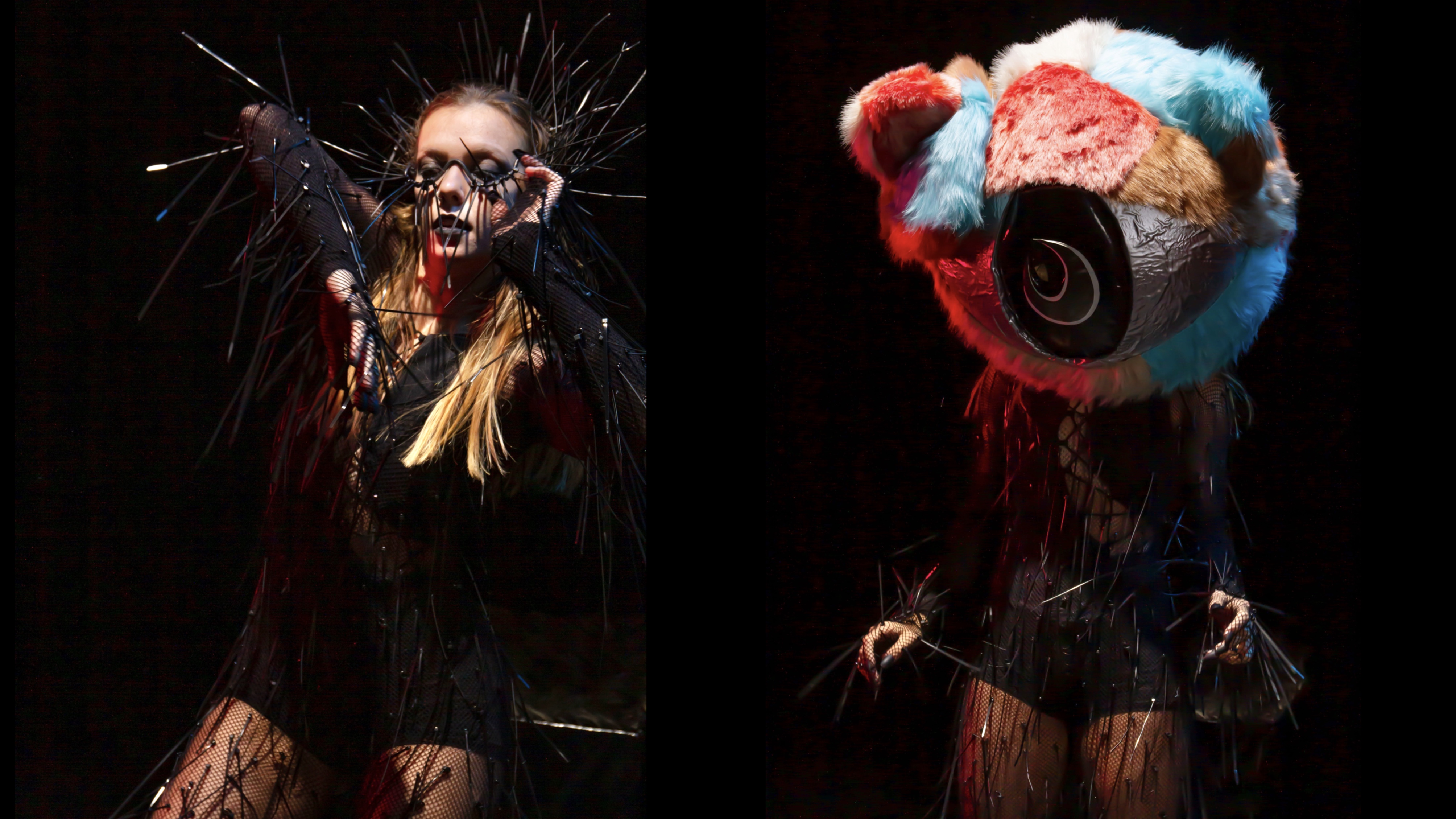 Two female models dressed in gothic black, one with a colourful teddy bear's head.