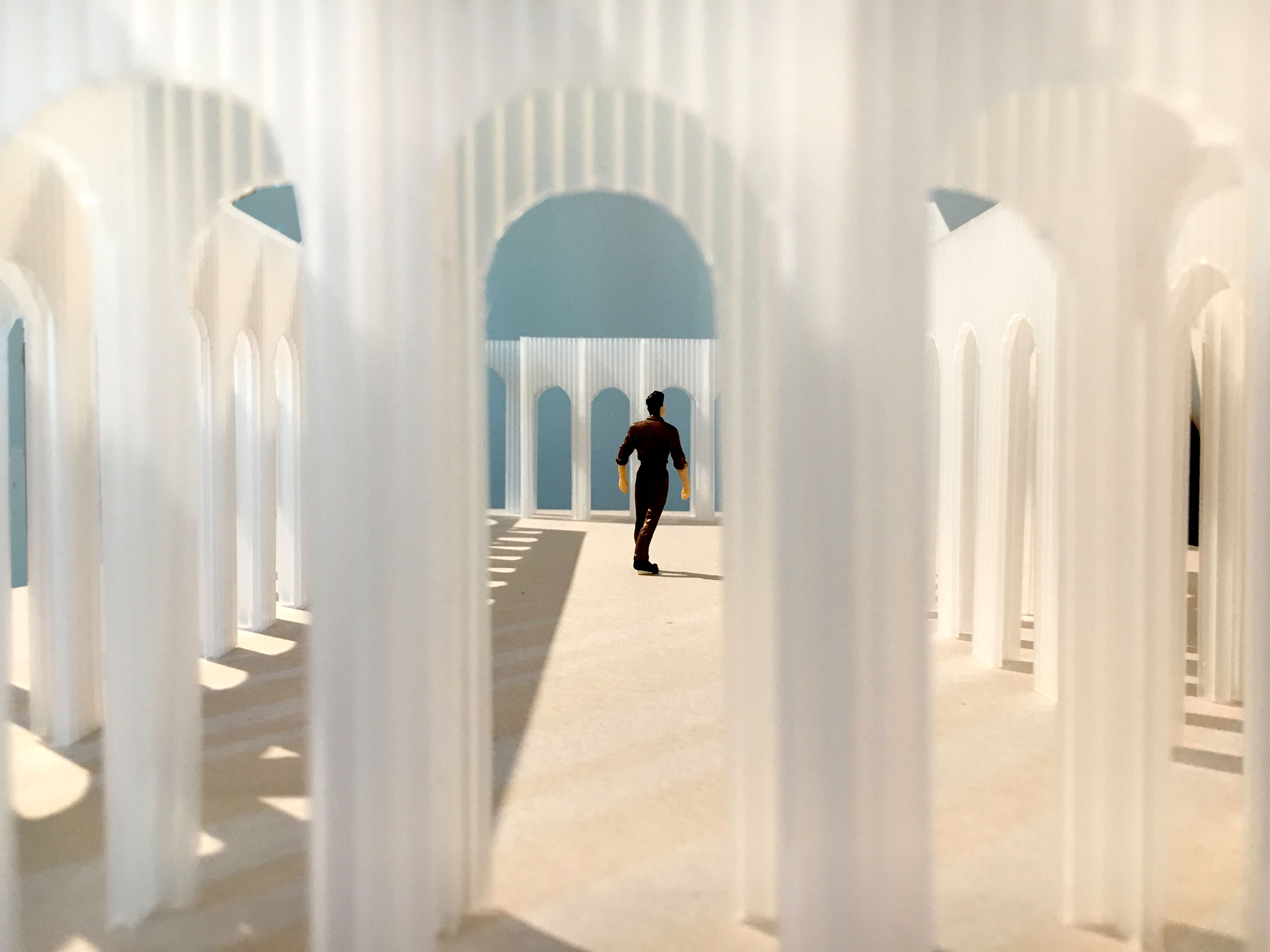 Conceptual image depicting man within translucent arches