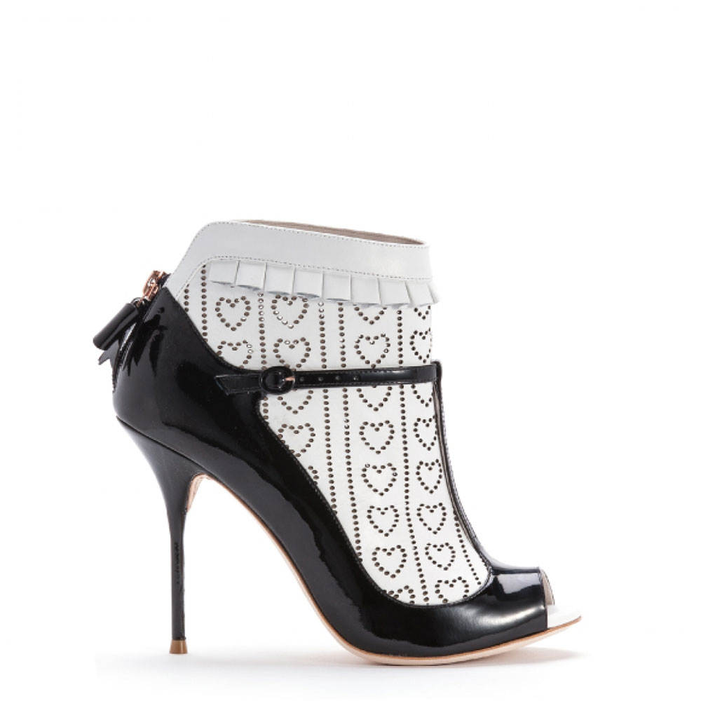‘Sadie’ by Sophia Webster. Black patent t bar with white calf laser cut sock detail.