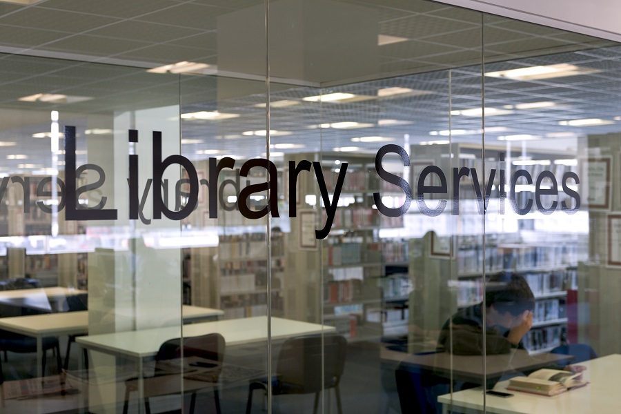 Text Library Services on some glass doors