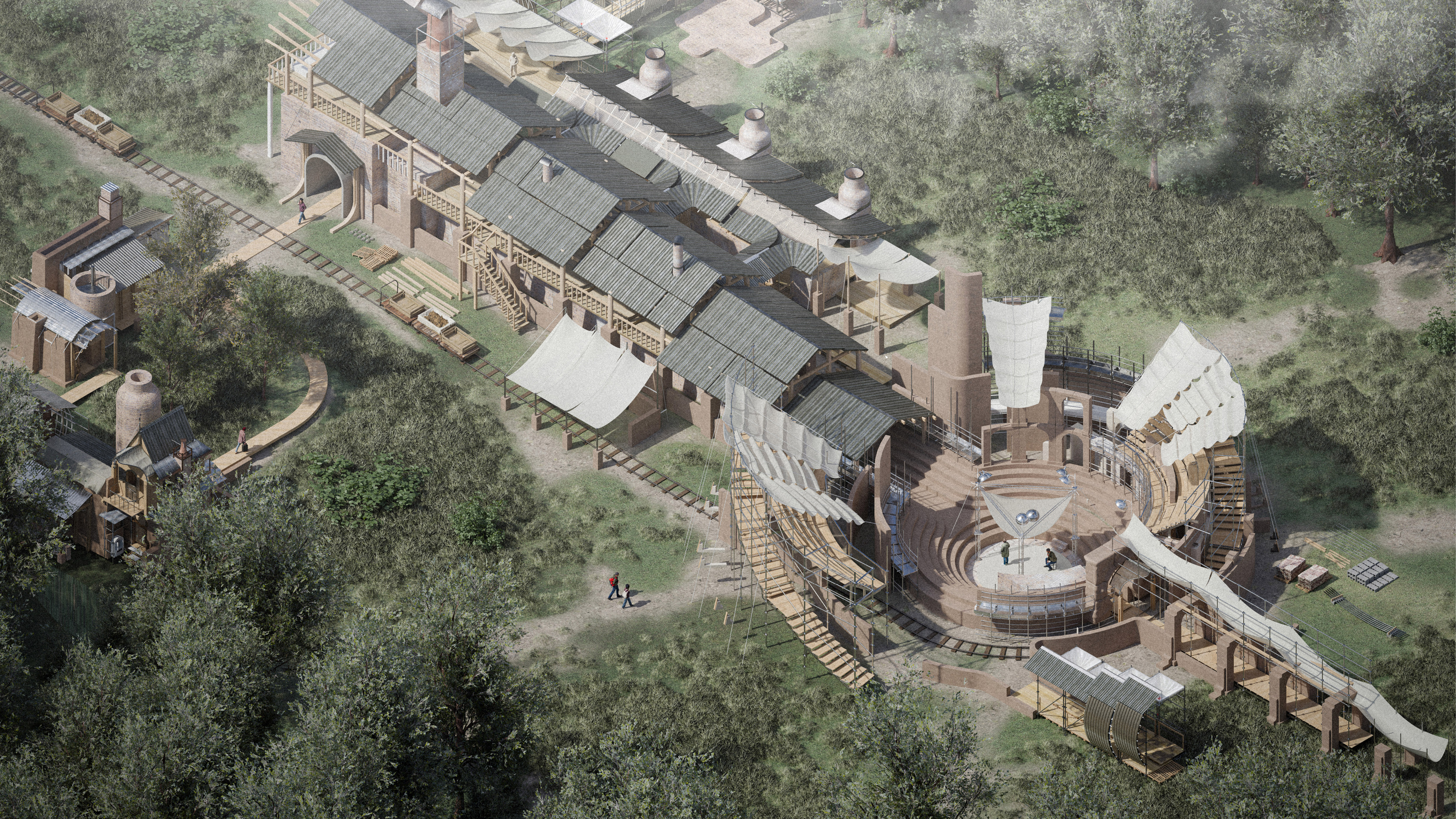 An architectural design rendering viewed from an elevated, bird's-eye perspective. A large, complex building sits within a wooded landscape surrounded by mature trees, grassland and winding paths. The design combines industrial, workshop and performance-space elements. Materials appear to be primarily brick, timber, metal roofing and fabric canopies. Narrow rail tracks run around parts of the site.