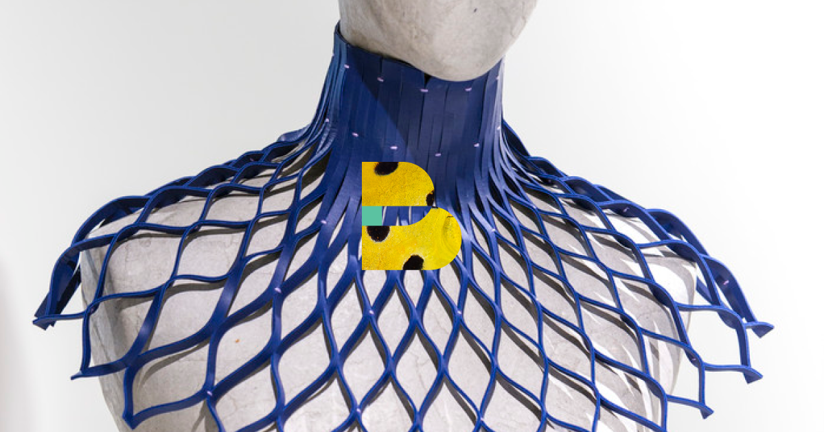 A white mannequin with net-shaped blue fabric over it