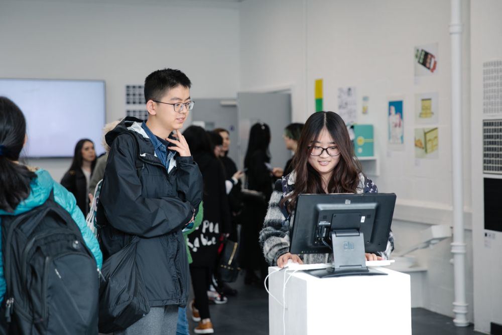 two students looking at computer