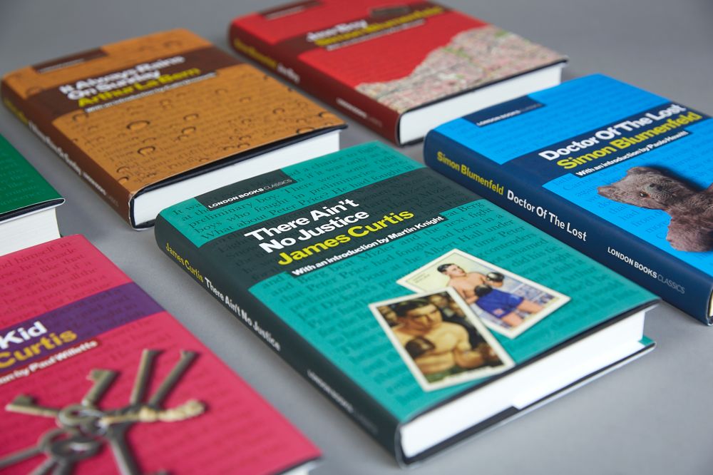 books laid out in rows on table