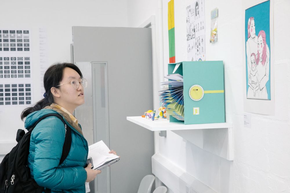 student observing art