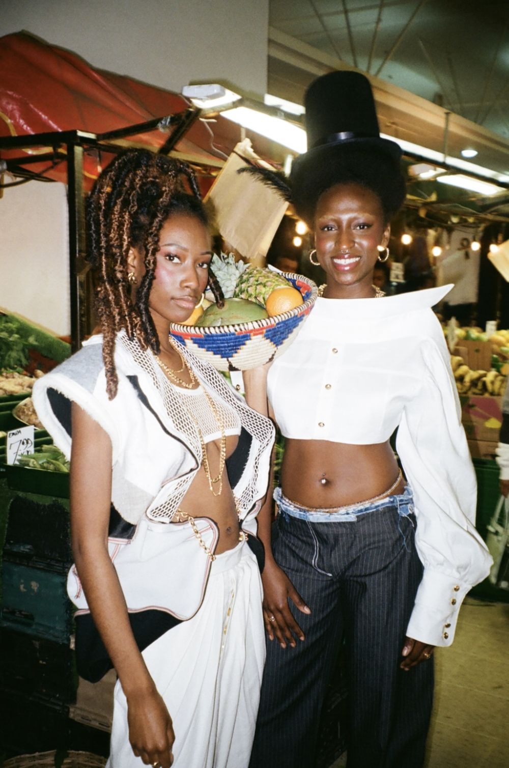 Models dressed in Unique's clothing at night market 