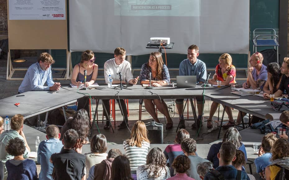 People sat around a large round table 