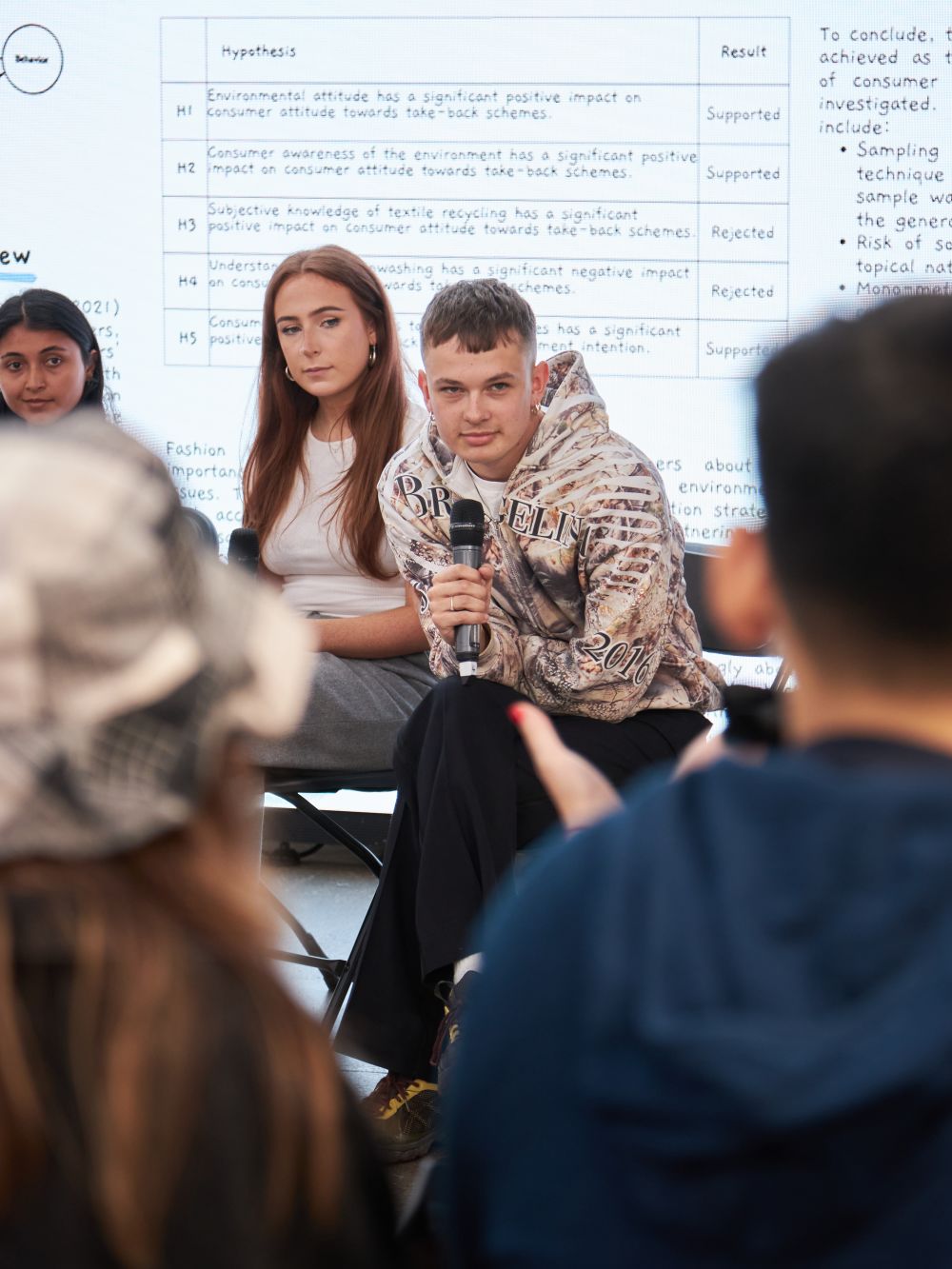 Close up of a panellist speaking to crowd