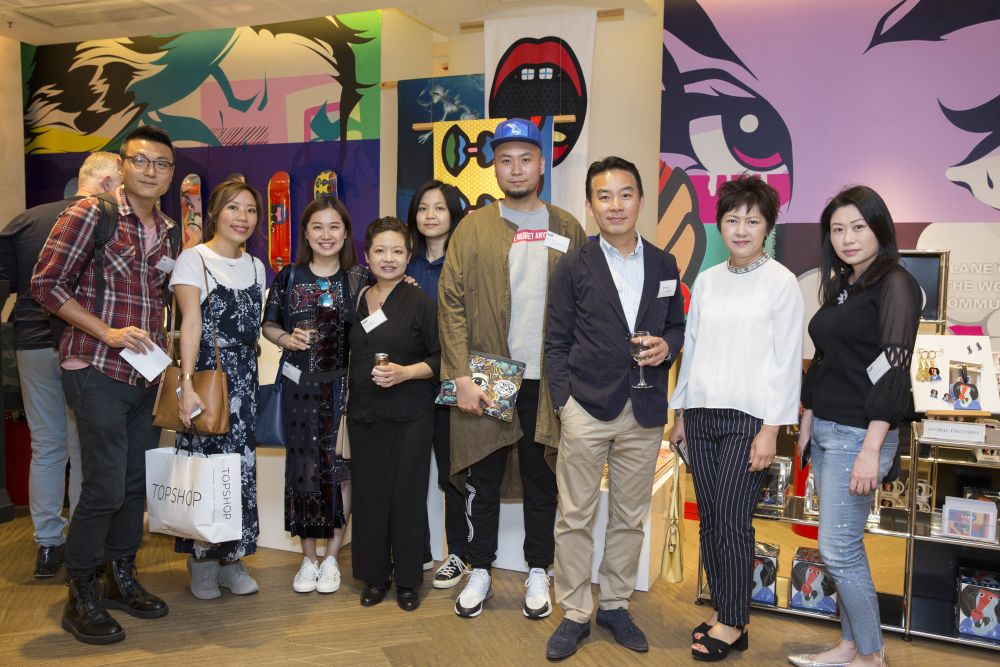 Group of people against a graphic background