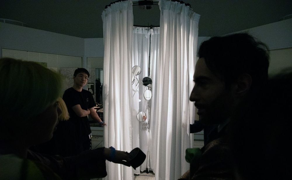 A round, white curtain stands in the middle of the V&A.