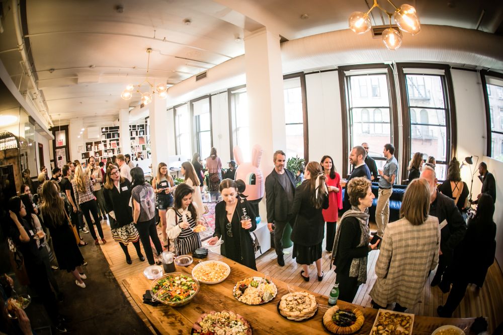 Photo with a fish-bowl lens, of guests in large room