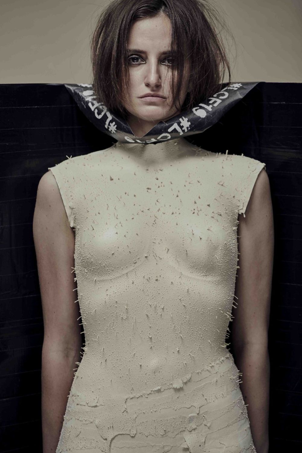 The plaster-cast bust of a model's form is wrapped in LCF19 tape.