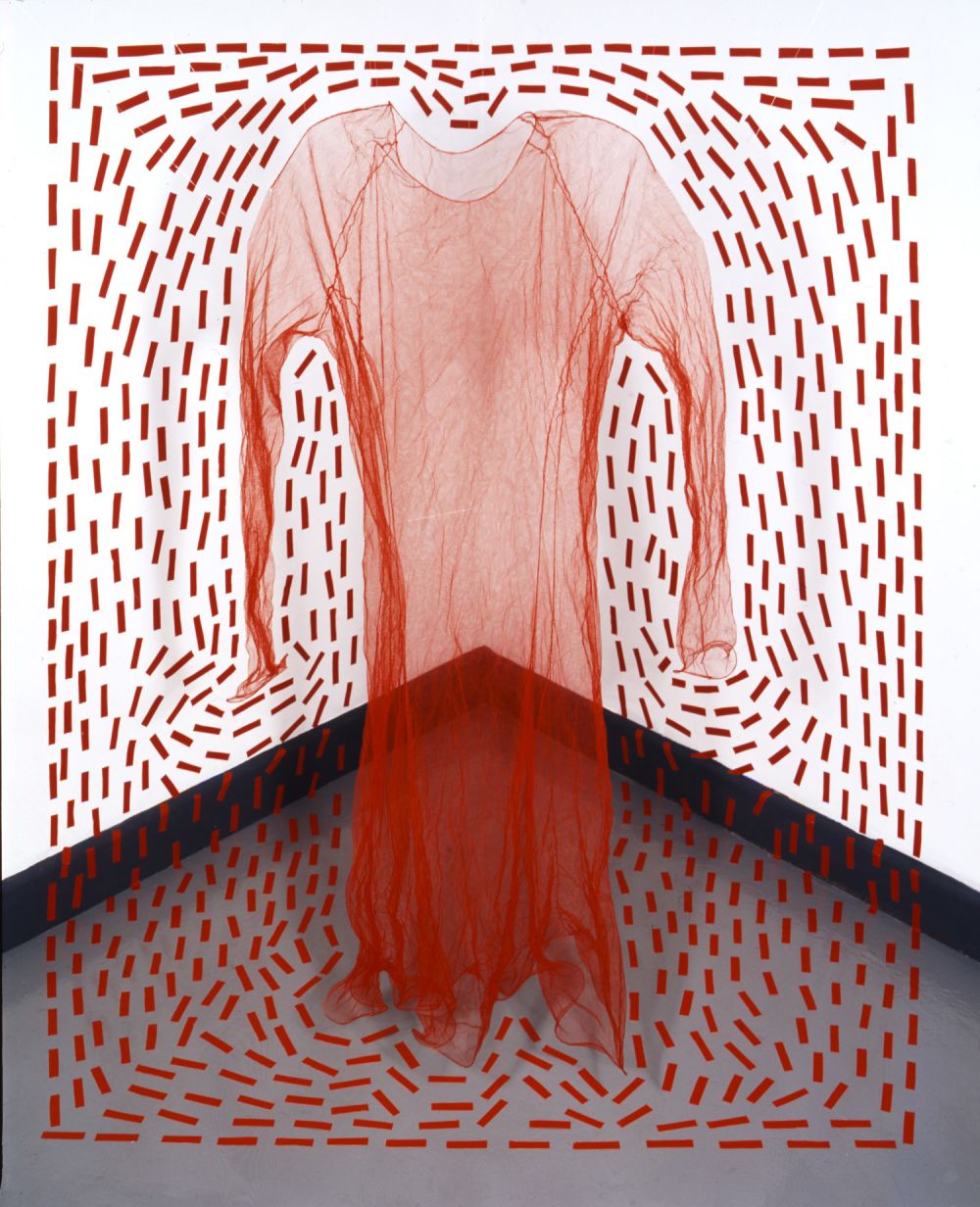 A sheer red dress surrounded by red dashes