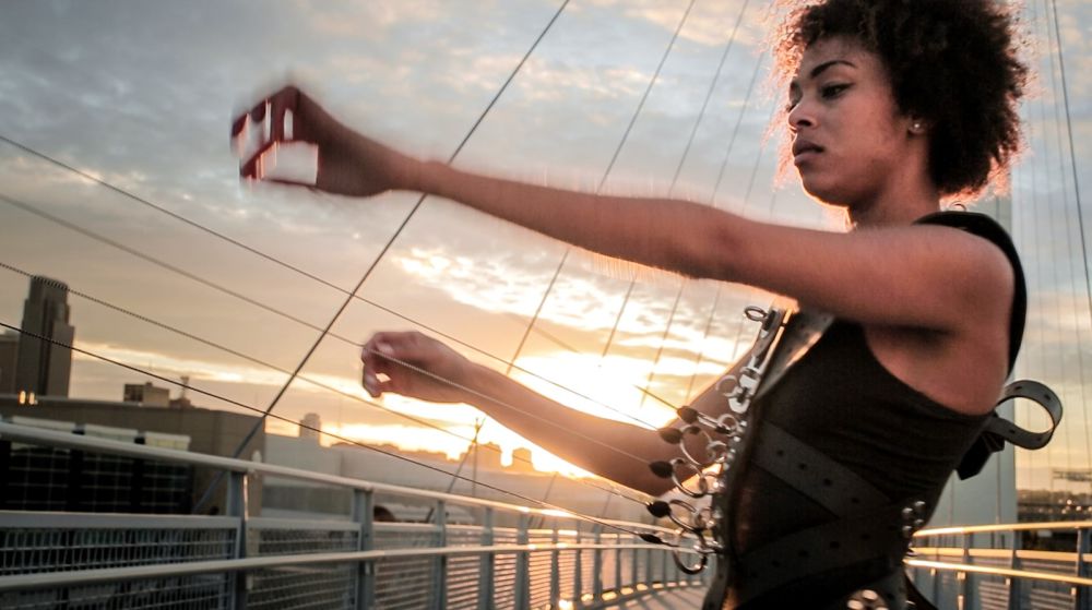 A woman plays the Human Harp on a bridge in Omaha, USA