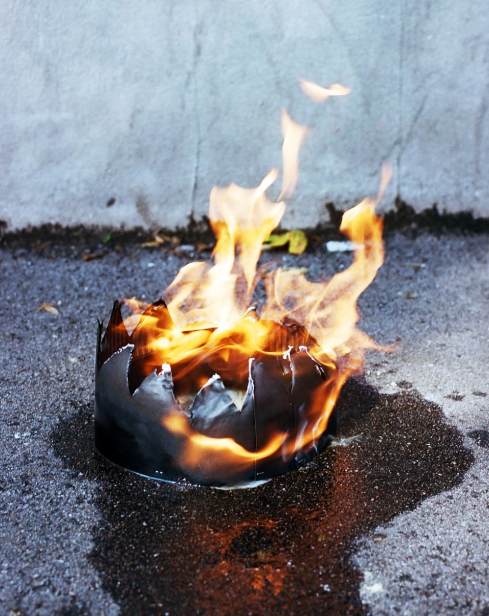 Close up shot of a crown made of cardboard on fire