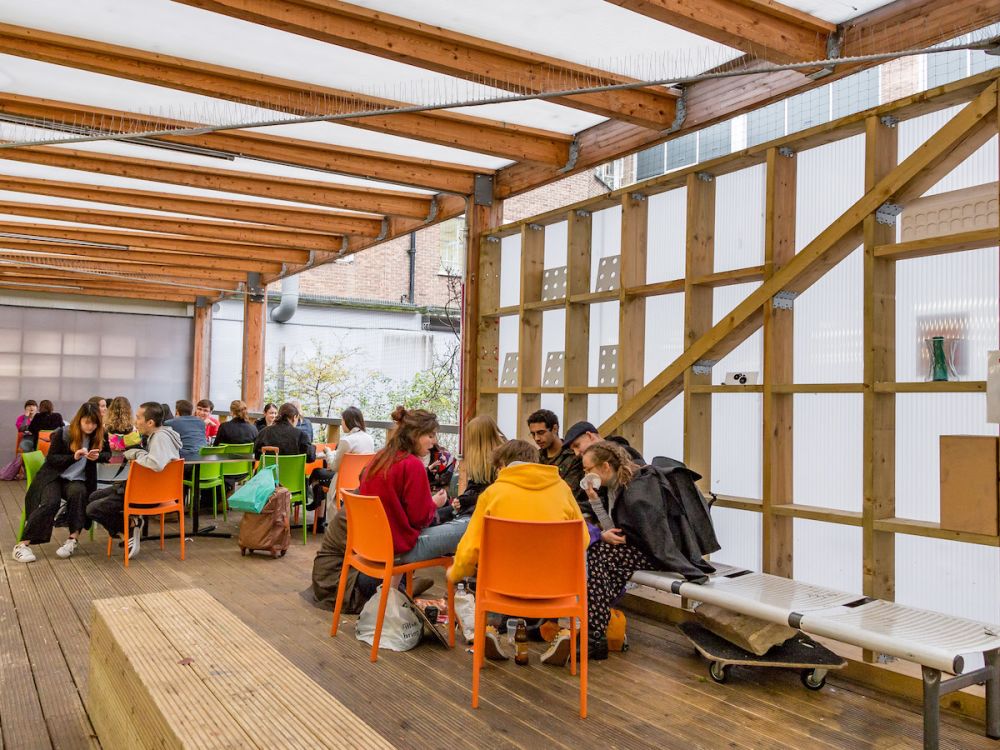 People on the outdoor terrace at Central Saint Martins' Archway campus
