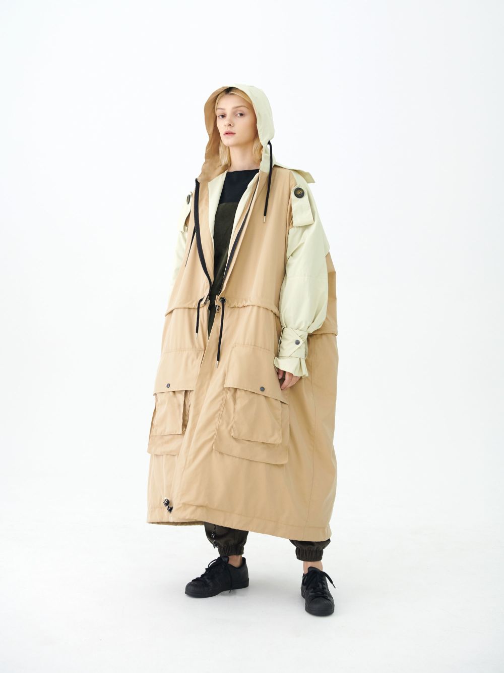 Female model in cream coloured oversized coat