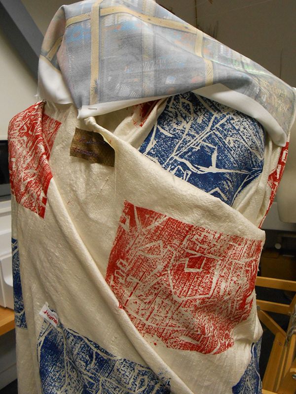 Fabric printed with blue and red patterns