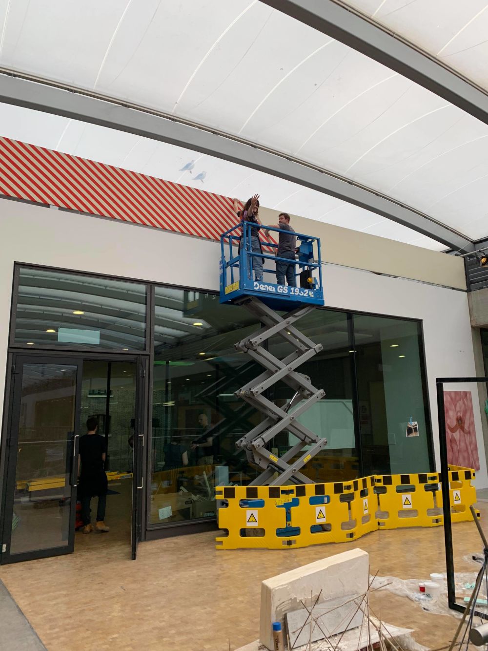 Striped frieze being installed