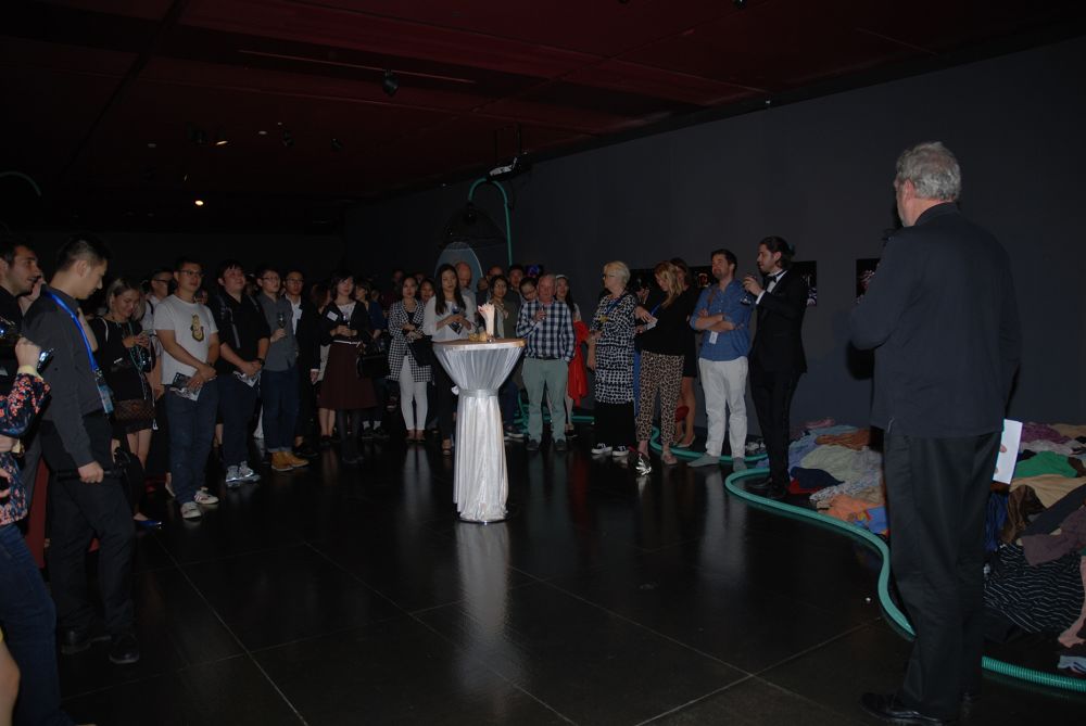 Audience listening to man talk