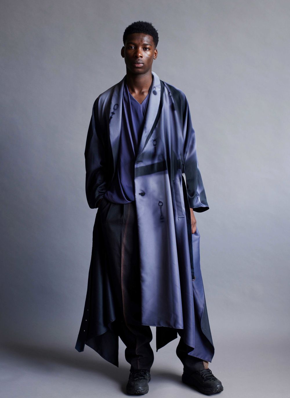 Man standing wearing blue clothes
