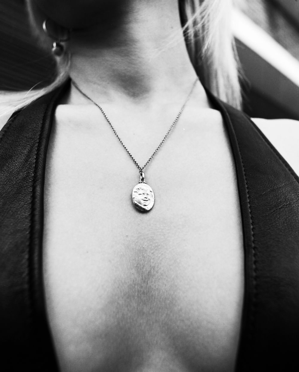 Close up shot of a woman's pendant