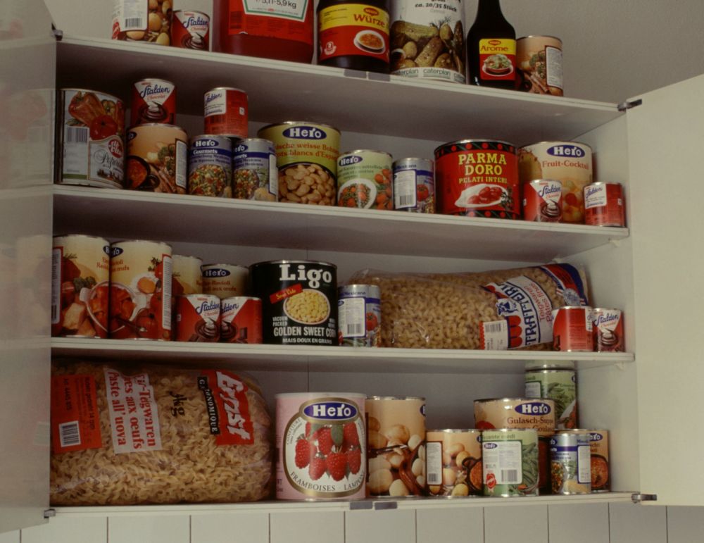 cuploard full of brightly coloured branded foods