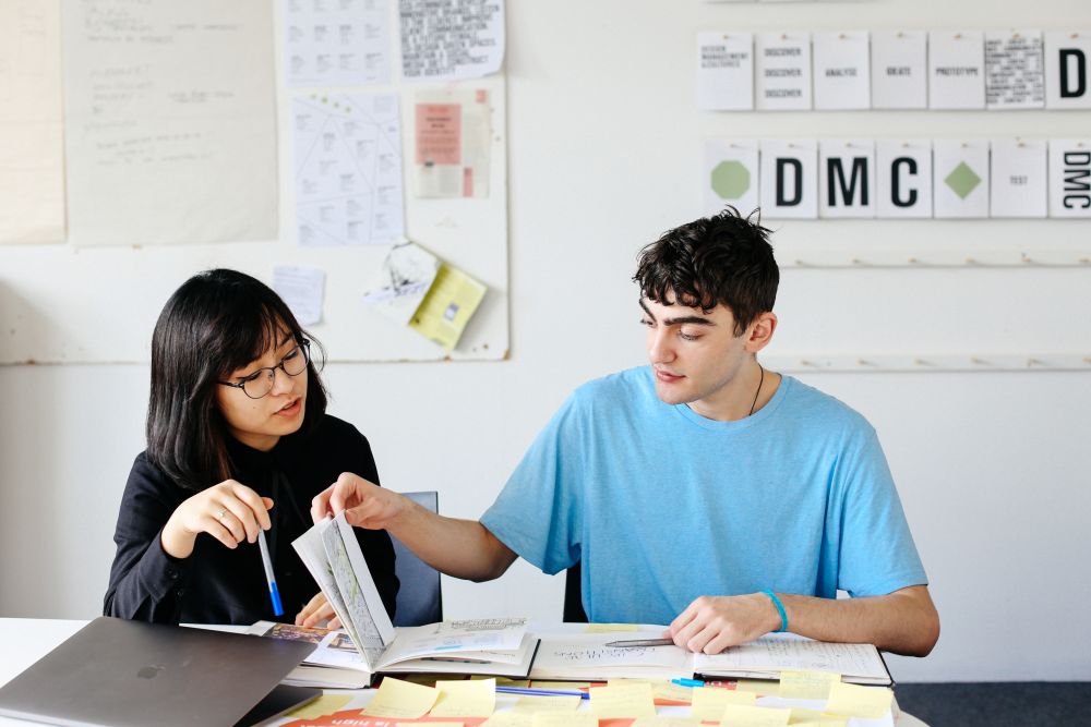 BA (Hons) Design Management student Ngoc (Sam) Trieu working in the studio at London College of Communication with Calvin England