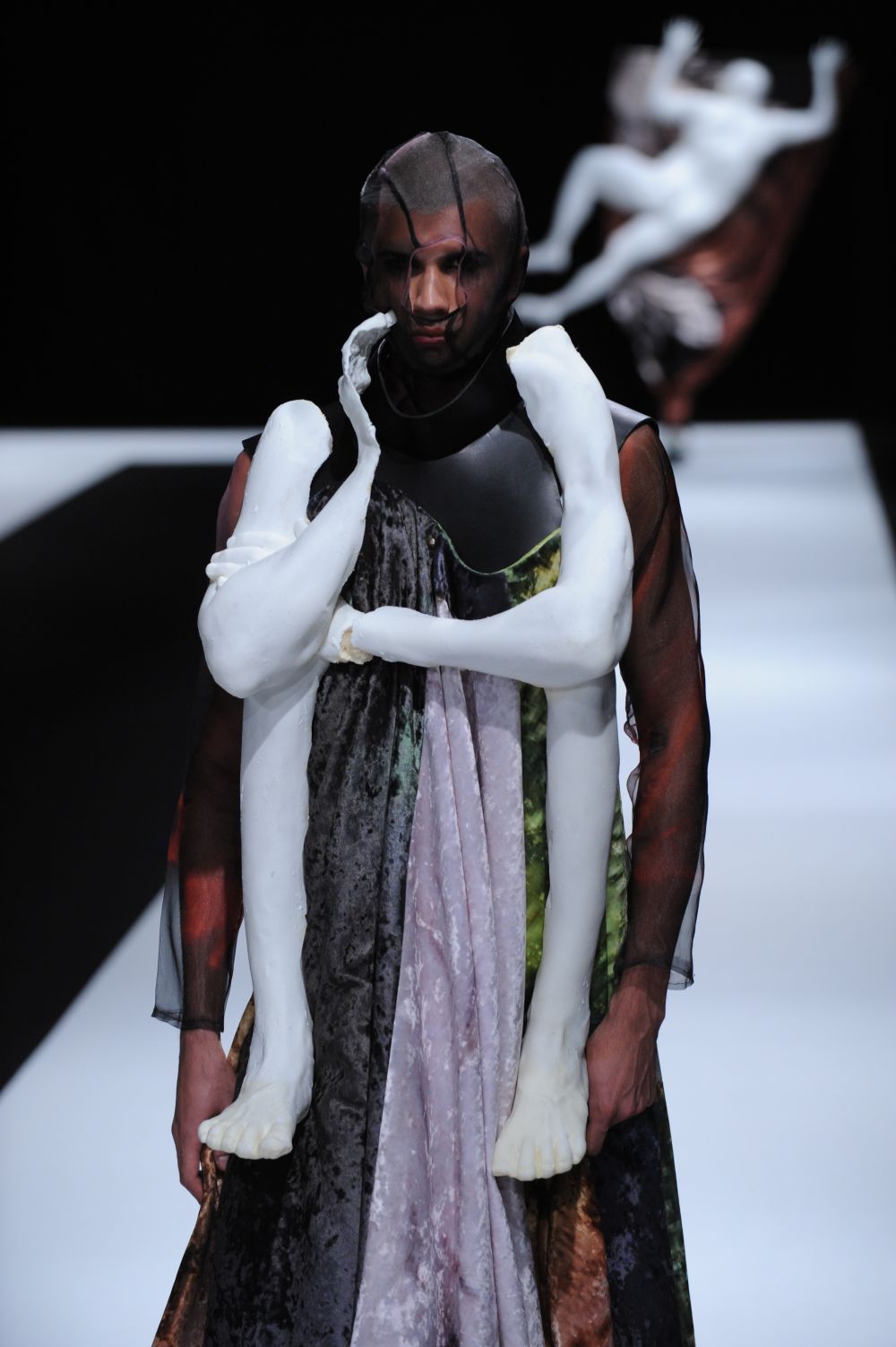 models on runway wearing artefact limbs