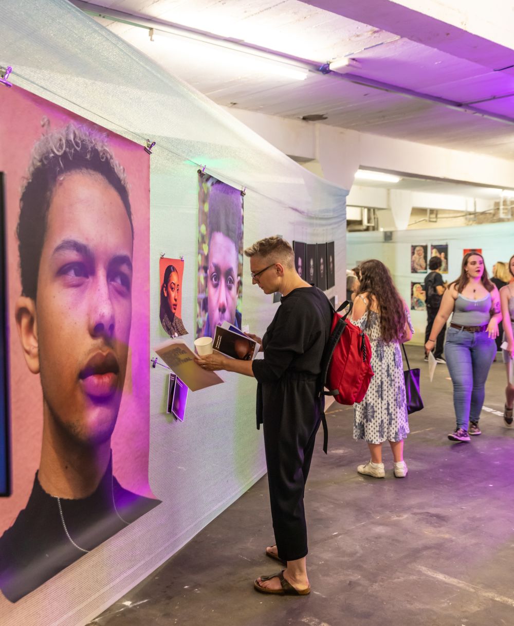 Guests look at the artwork