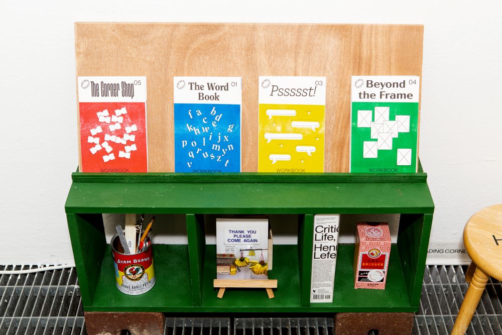 An installation showing objects in a replica corner shop.
