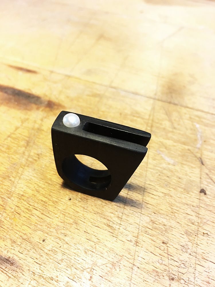 Wooden ring with pearl.
